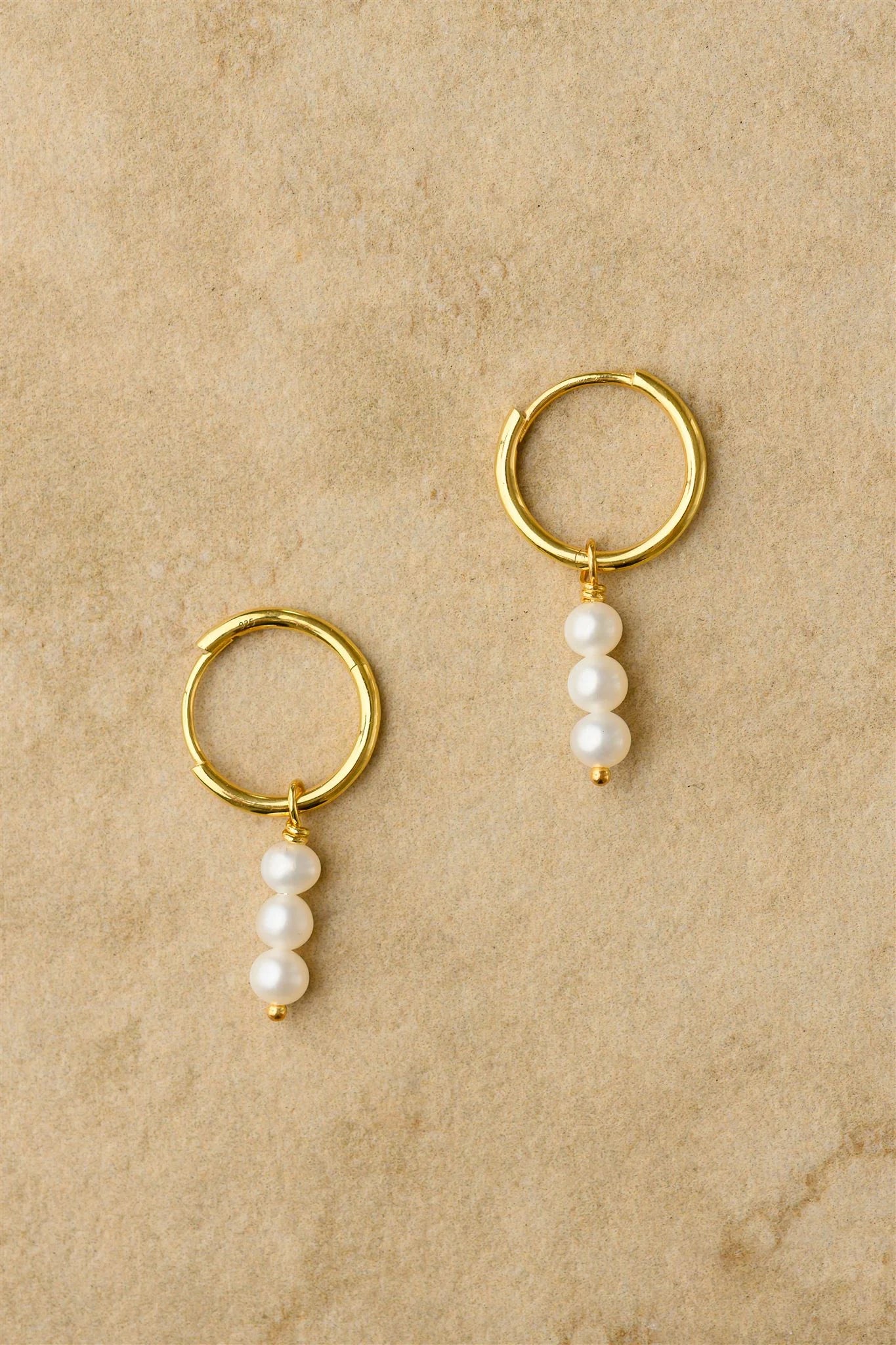 Gold earrings with pearl drops