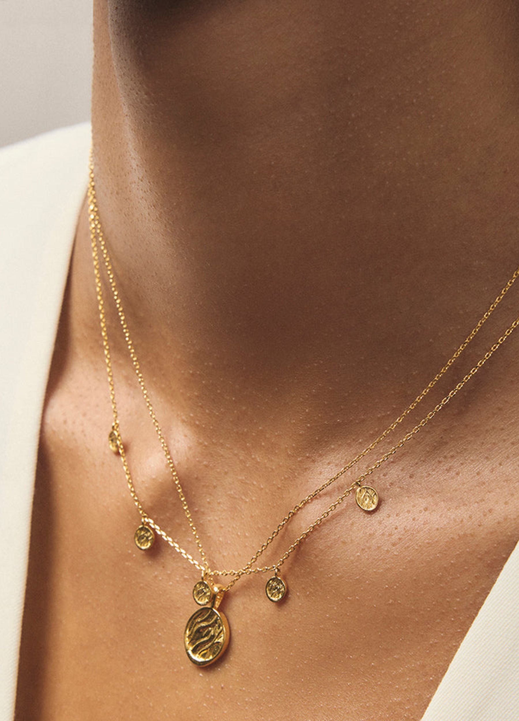 Gold charm necklace from Jolie & Deen