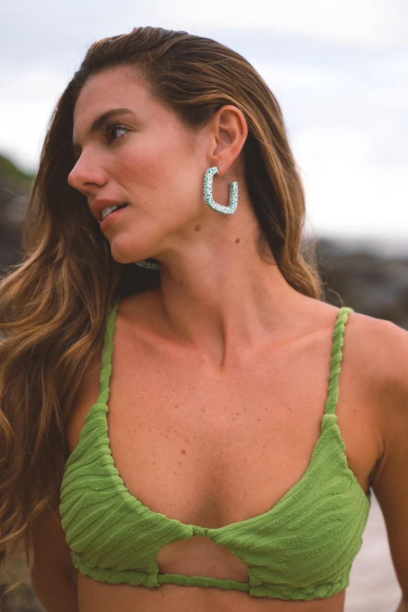 Model wearing Kitty Paloma Mint Terrazo Hoop Earrings