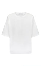 White tee with black motif on back saying Mon Cheri