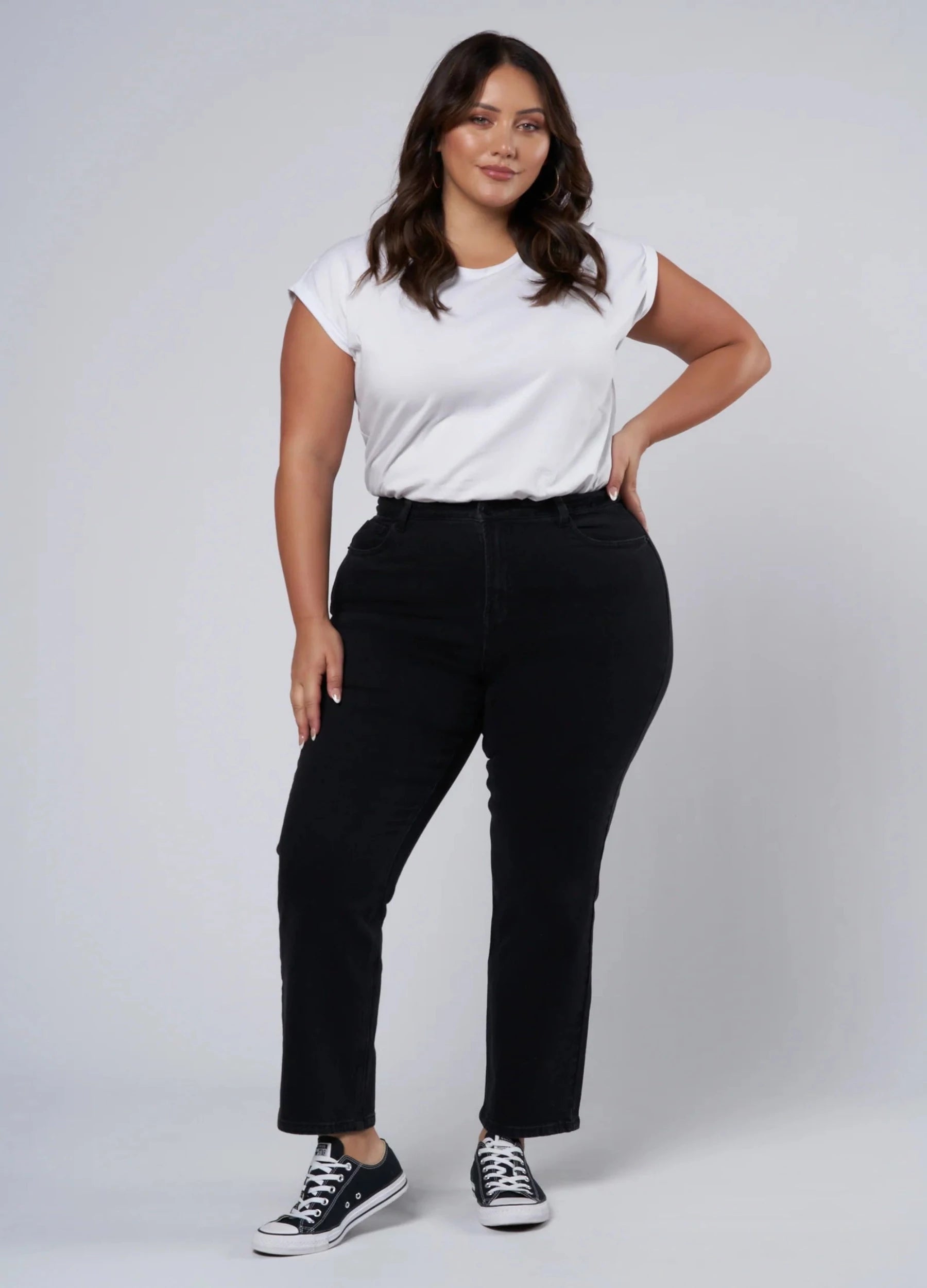 Plus size black jean cut for curves, cropped at hem