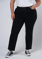 Plus size black jean cut for curves, cropped at hem