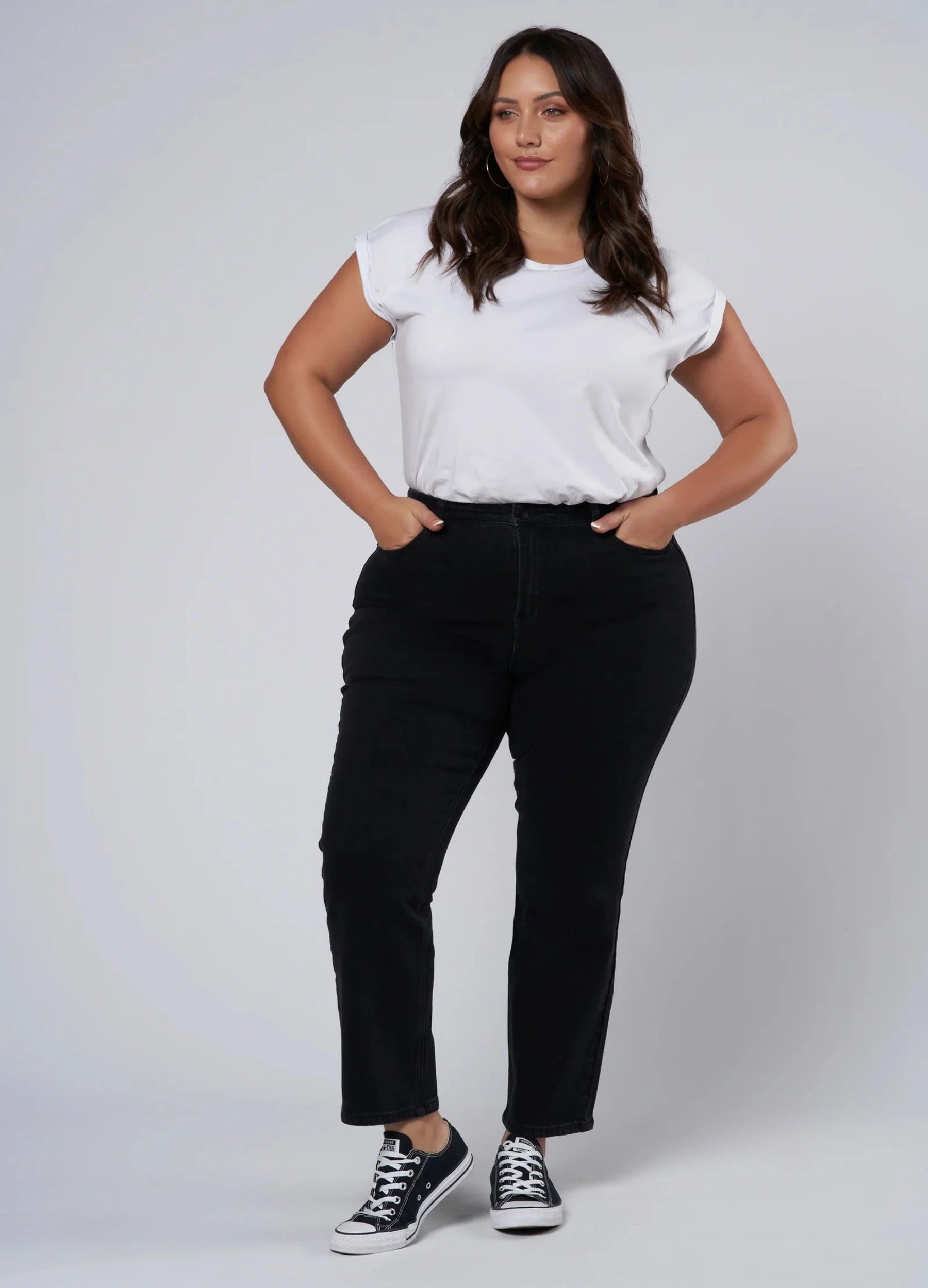 Plus size black jean cut for curves, cropped at hem