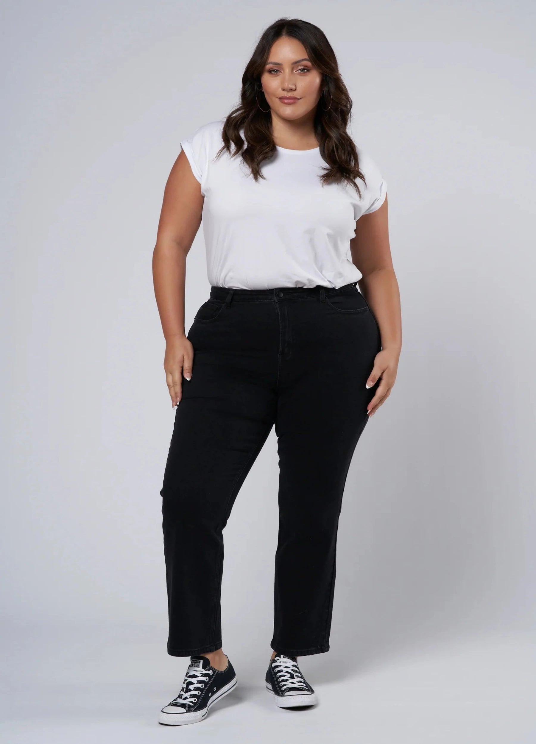 Plus size black jean cut for curves, cropped at hem