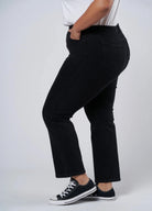 Plus size black jean cut for curves, cropped at hem