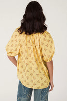 Yellow floral print blouse with button up front