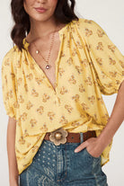 Yellow floral print blouse with button up front