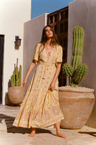 Yellow floral maxi dress with button through details and elasticated ties