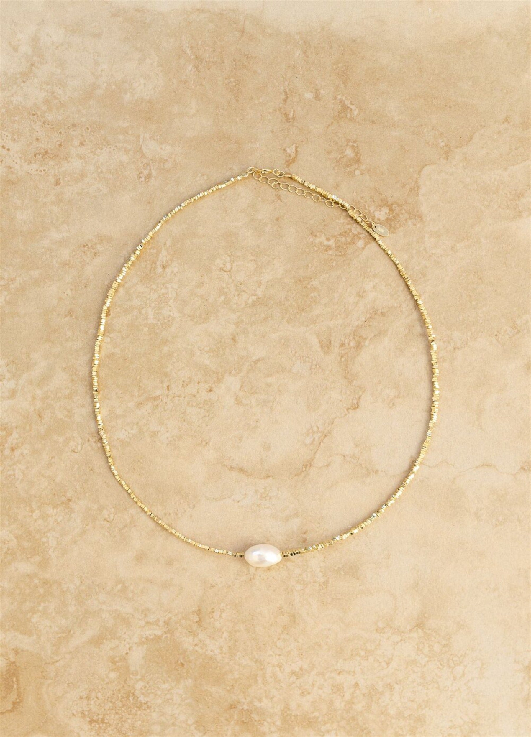 The gold and pearl tahiti necklace from indigo and wolfe - choker length